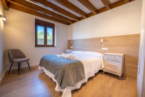 Postel nebo postele na pokoji v ubytování Apartamentos Rurales Quintanilla