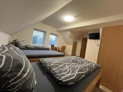 Säng eller sängar i ett rum på SK family - Ubytování v rodinném domě