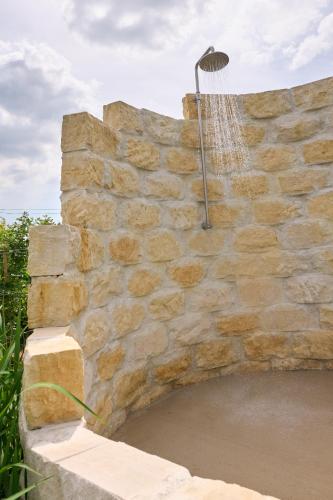 a stone wall with a volleyball net on it at Apartments Vineyard19 in Retz