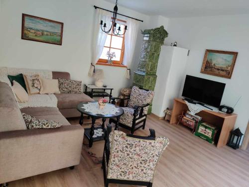 a living room with a couch and a table at Ubytovanie Pod Rotundou in Skalica
