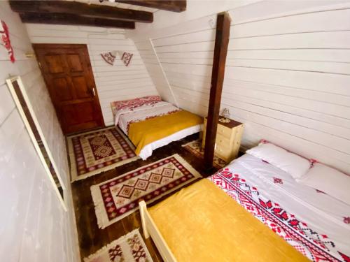 Postel nebo postele na pokoji v ubytování La Șofran