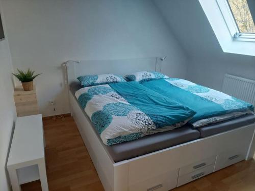 Кровать или кровати в номере Ferienwohnung Schmidt
