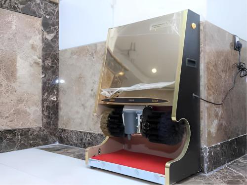 a sewing machine with a mirror in a room at Nasamaat Ajyad Hotel in Mecca