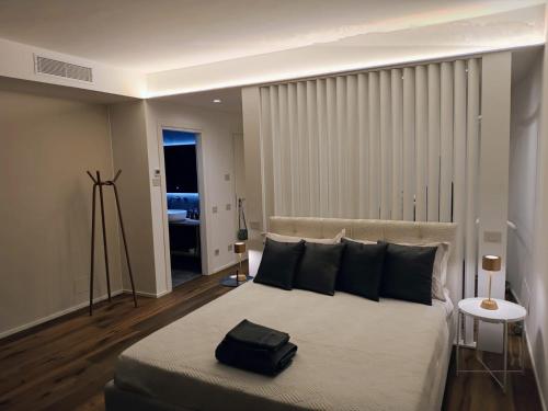 Ένα ή περισσότερα κρεβάτια σε δωμάτιο στο Residenze SiMari Luxury
