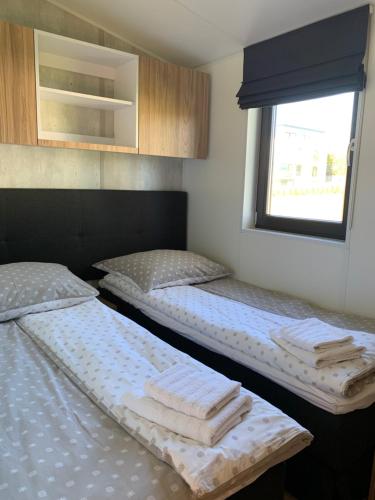 Ένα ή περισσότερα κρεβάτια σε δωμάτιο στο Apartamenty Lido