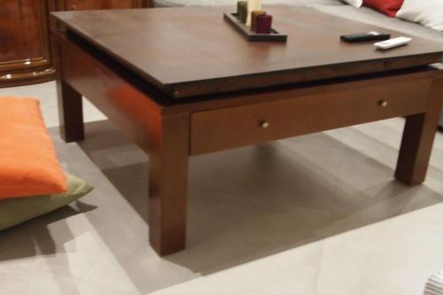 a wooden coffee table in front of a couch at Big Oasis near the center of Athens in Athens