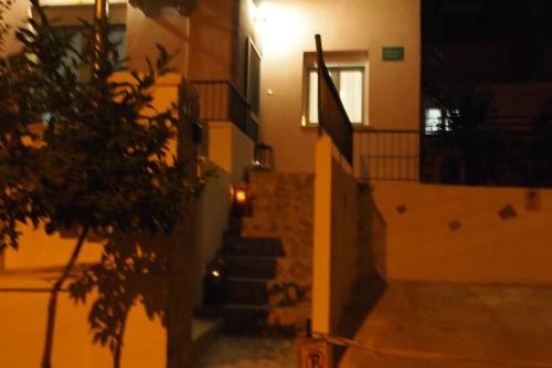 a stairway leading to a building at night at Big Oasis near the center of Athens in Athens