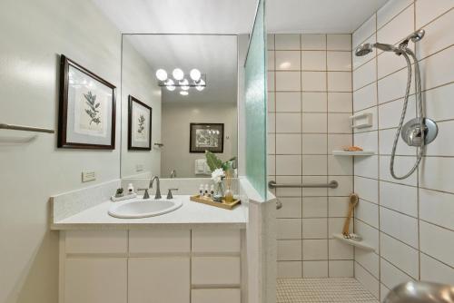 a bathroom with a sink and a shower at Eldorado L202 in Kahana