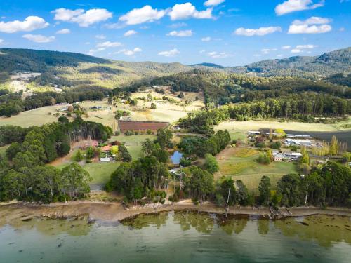 an aerial view of a park next to a lake at Blissful Birchs Bay - Gorgeous 3 Bedroom House in Woodbridge