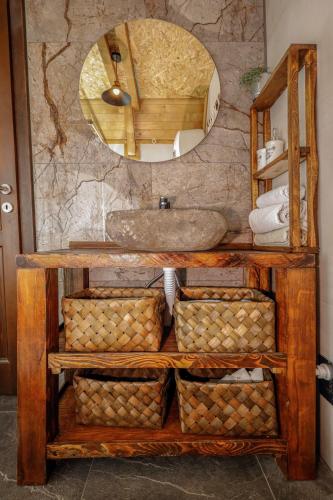 a bathroom with a sink and a mirror at Village house Iva in Livno
