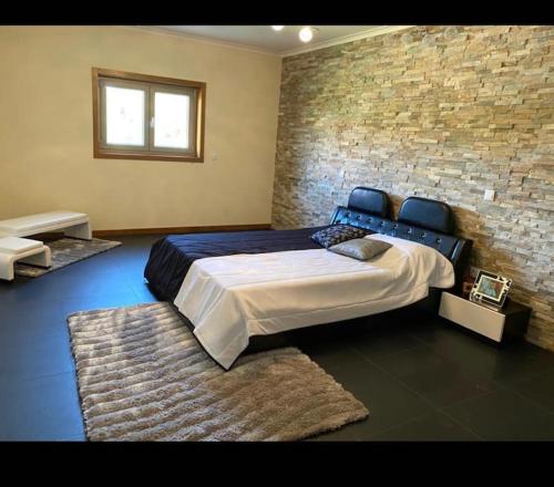 Postel nebo postele na pokoji v ubytování Moradia de Sonho com Piscina
