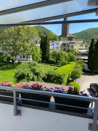 a view from the balcony of a house with a garden at Pension am Treiser Kiosk in Treis-Karden