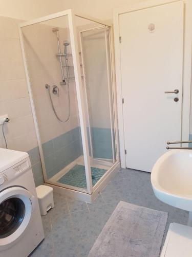 a shower with a glass door in a bathroom at Sottomarina Beach Life in Sottomarina