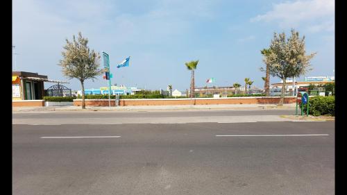 an empty street in front of a gas station at Sottomarina Beach Life in Sottomarina