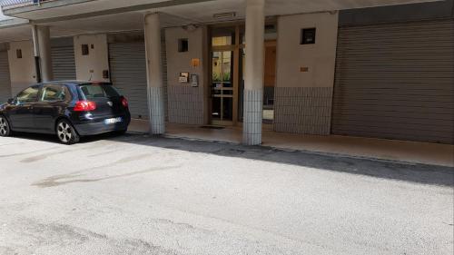 a car parked in front of a building at Sottomarina Beach Life in Sottomarina