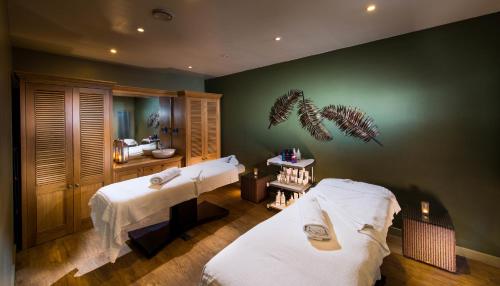 a room with two beds in a room at Chevin Country Park Hotel & Spa in Otley