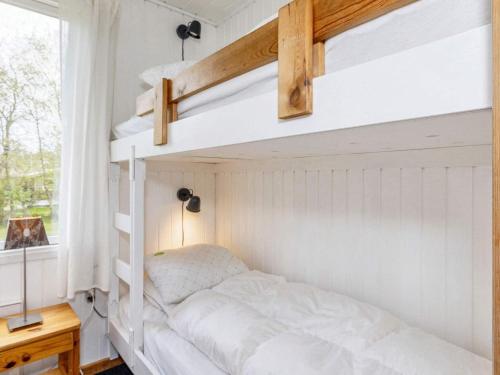 a bedroom with a bunk bed and a window at 6 person holiday home in Farsø-By Traum in Farsø