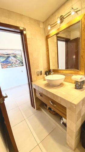 a bathroom with a sink and a mirror at Ajijic San Antonio Lake Chapala Villas - Pickleball Court - Gym in San Antonio