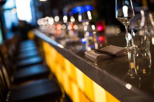 a bar with glasses of wine and a napkin at Renaissance Montreal Downtown Hotel in Montréal
