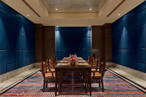 a conference room with a long table and chairs at Sheraton Grand Bengaluru Whitefield Hotel & Convention Center in Bangalore