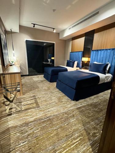 Postel nebo postele na pokoji v ubytování Dana Hotel