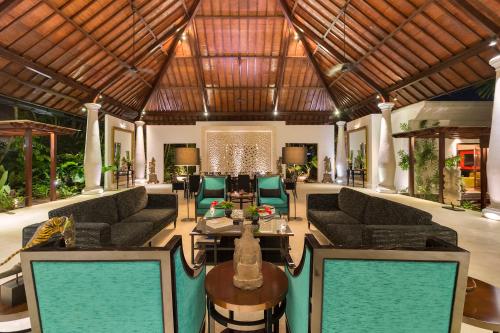 a large living room with couches and a table at Luxury Bali Estate Canggu in Munggu