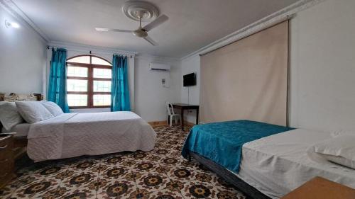 Posteľ alebo postele v izbe v ubytovaní Casa Mayor Manga - Cartagena