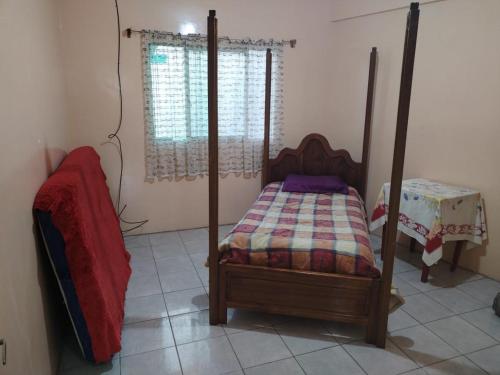 A bed or beds in a room at Baratingo