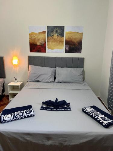 a bedroom with a bed with two pillows on it at Casa serra do Caparaó in Caparaó Velho