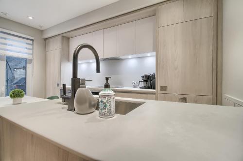 a kitchen with a sink and a faucet at Luxury Townhouse in Downtown Toronto - TH4 in Toronto