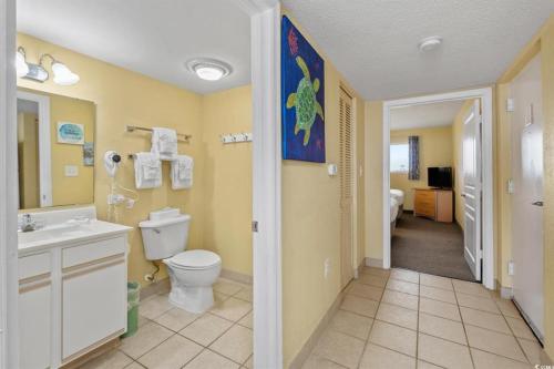 a bathroom with a toilet and a sink at North Myrtle Beach 1BR Oceanfront Condo at Bay Watch in Myrtle Beach