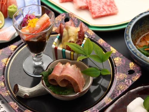 a plate of food with a sandwich and a drink at Takanoya in Yuzawa