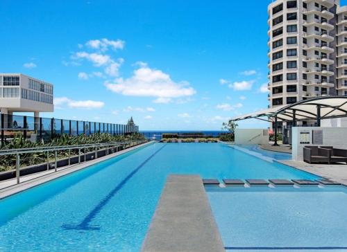 a swimming pool on the roof of a building at Broadbeach Luxury Oracle Tower 1 Apartment 2Bed 2Bath 1 Car in Broadbeach