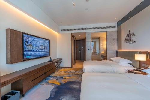 Postel nebo postele na pokoji v ubytování Sheraton Kunming