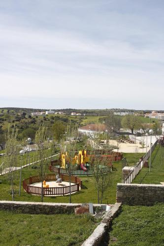 a park with a playground with a slide at Casa da Avó Ilda in Miranda do Douro