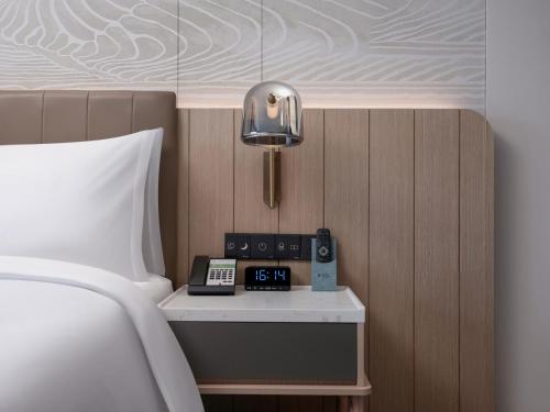 Ένα ή περισσότερα κρεβάτια σε δωμάτιο στο Holiday Inn Quzhou by IHG