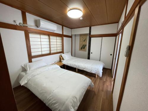 Cama o camas de una habitación en i Home Osaka ZEN NEST 一户建