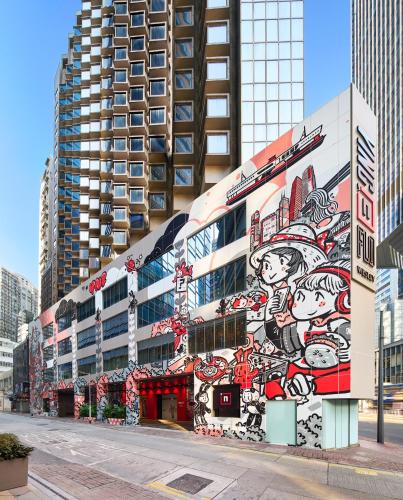 a building with a mural on the side of it at Ying'nFlo, Wesley Admiralty, Hong Kong in Hong Kong
