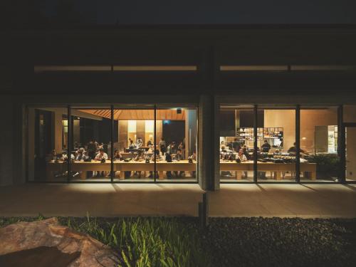 a group of people sitting at tables in a building at SOKI ATAMI in Atami