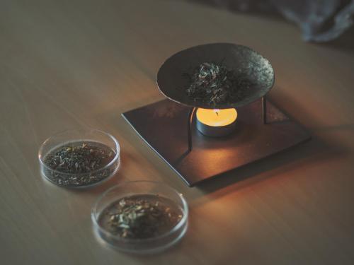 a table with two bowls of food and a candle at SOKI ATAMI in Atami