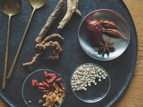 a table with a plate of food with nuts and spices at SOKI ATAMI in Atami