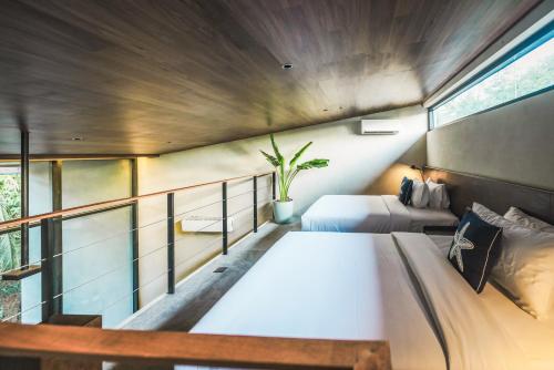 Letto o letti in una camera di Piece Lio from Japan Managed by H Hospitality Group