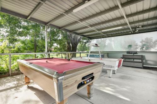a pool table on a patio with awning and a pool table at Tasman Holiday Parks - Hervey Bay in Hervey Bay