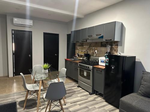 Η κουζίνα ή μικρή κουζίνα στο Sayula luxury apartments