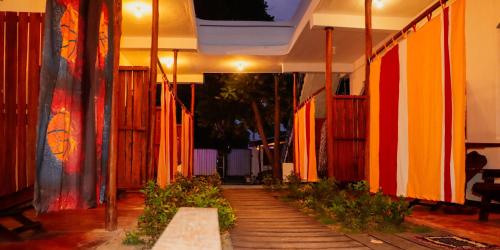 a hallway with brightly colored walls and wooden floors at Surfers Park Arugambay in Arugam Bay