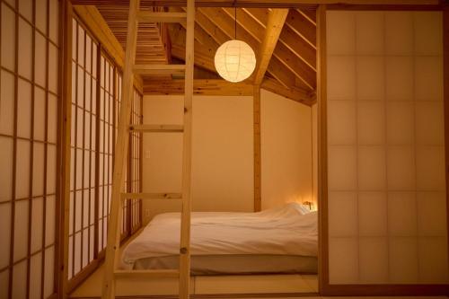 a room with a bunk bed and a lamp at Villa Amatsuboshi - Vacation STAY 83624v in Tahara