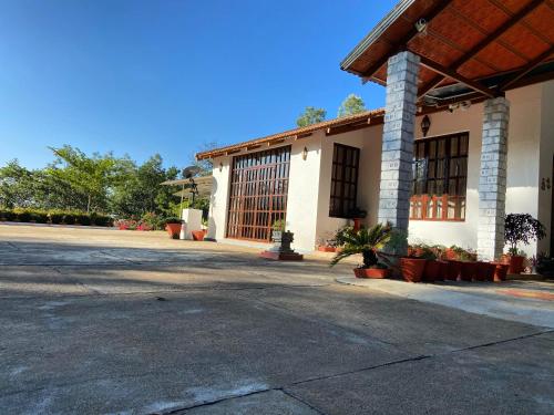 an empty parking lot in front of a building at The Sattva Nature Retreat in Avathi