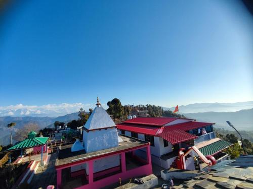 an overhead view of a building with a red roof at The Heavens in Almora
