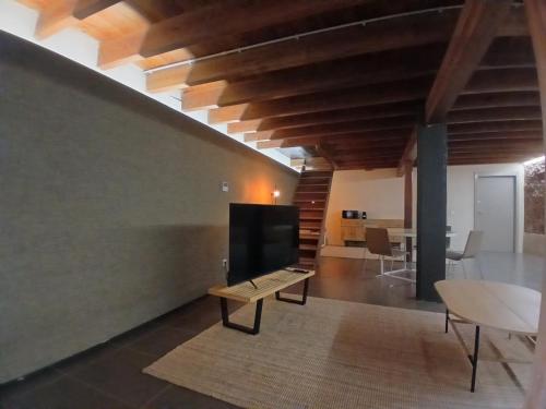 Un lugar para sentarse en Apartamento en molino con piscina