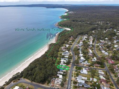 an aerial view of white sands walking track and the beach at Nelson's Oasis by the beach Apartment in Vincentia